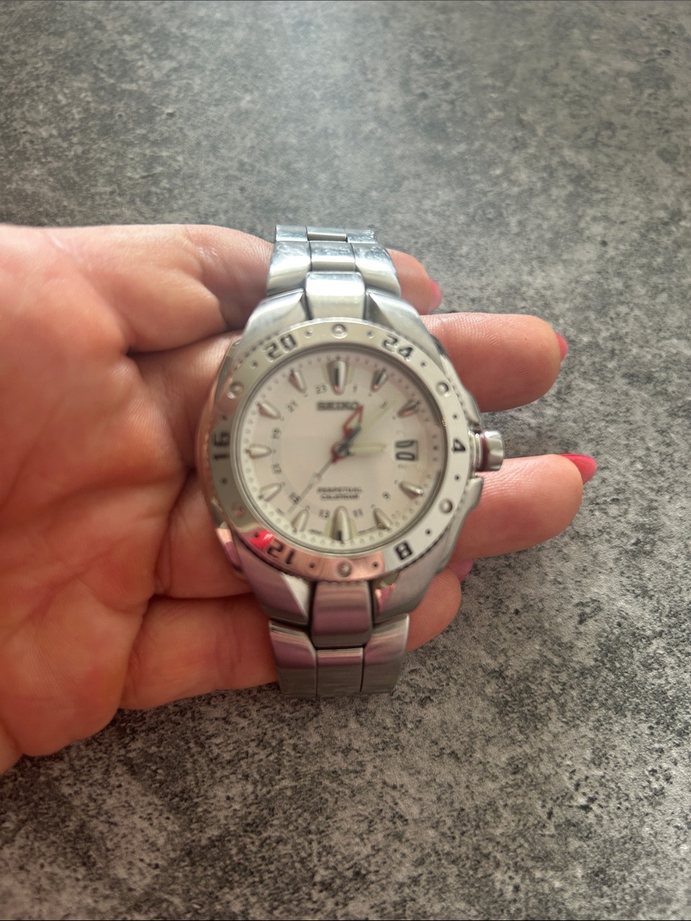 Vintage Seiko Silver Stainless Steel Watch with White Dial and Red-Tipped Hand
